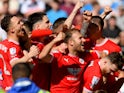 Barnsley's Nicky Cadden celebrates scoring their first goal with teammates on May 13, 2023