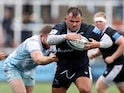 Newcastle Falcons' George McGuigan in action with Harlequins' George Head on September 10, 2022