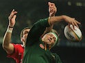 South African forward Hannes Strydom (R) reaches for the ball on June 21, 1997