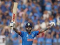 India's Virat Kohli celebrates after reaching his 50th century, breaking Sachin Tendulkar's record of most number of ODI centuries on November 15, 2023